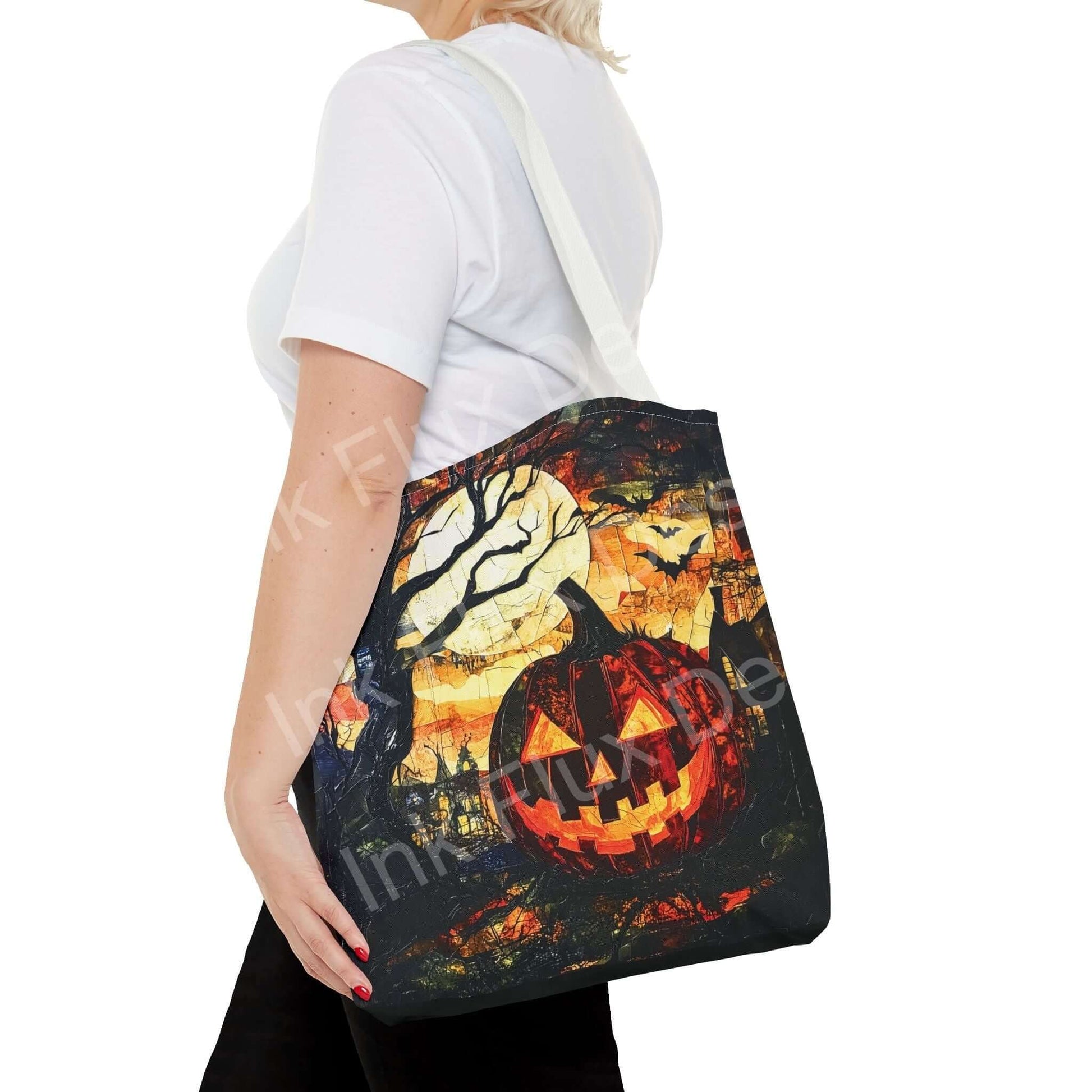 Woman carrying a Jack o Lantern Painting Tote Bag with all-over spooky-themed print and adjustable white strap.