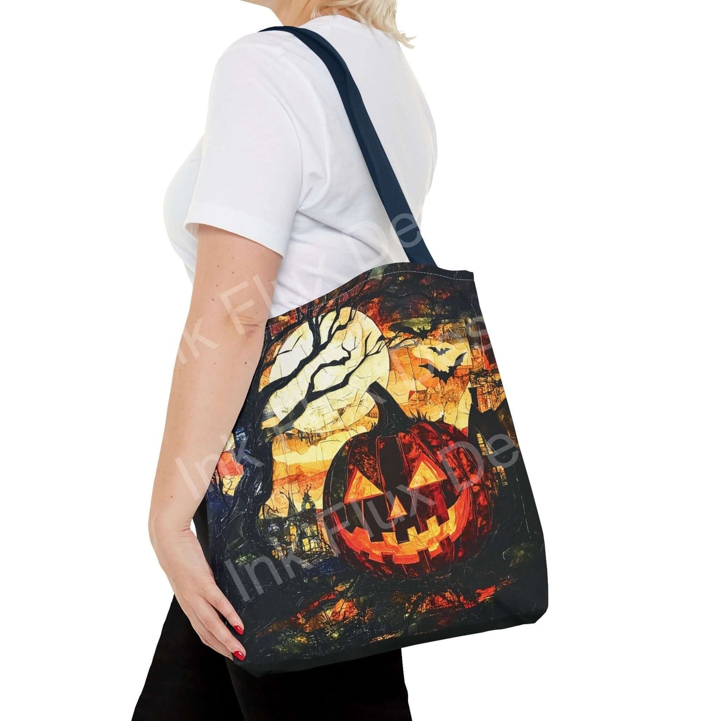 Woman carrying a Halloween-themed Jack o Lantern painting tote bag with artistic all-over print design.