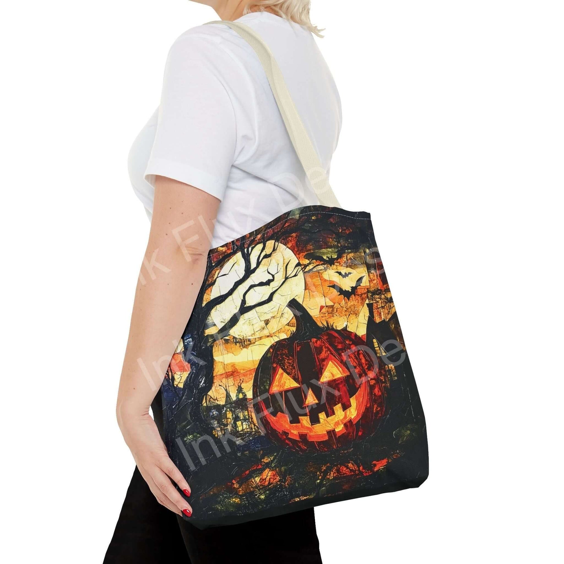Woman carrying a Jack o Lantern painting tote bag featuring vibrant Halloween-themed design with cotton straps.