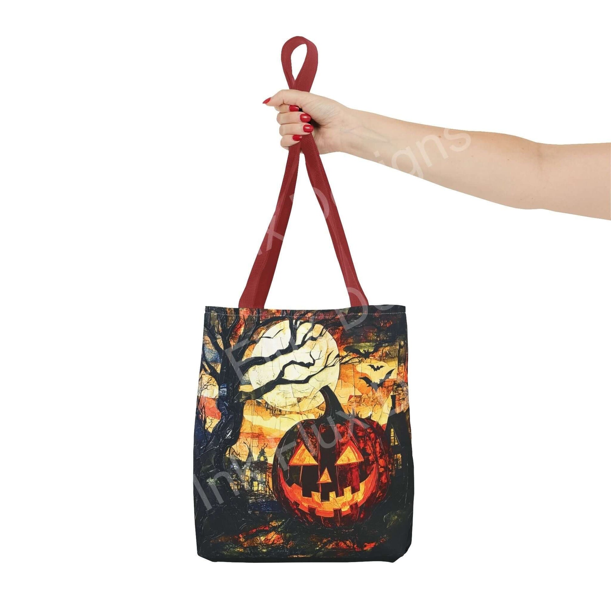 Woman holding a Jack o Lantern painting tote bag with red handles, featuring vibrant Halloween themed all-over print design