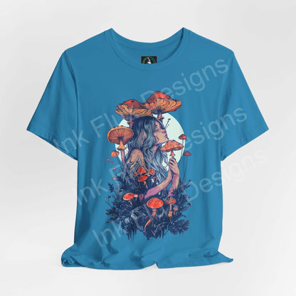 Unisex turquoise tee featuring a bold, psychedelic graphic of a woman with mushroom and floral imagery, from the 'Mushroom Lady VI' series by Bella+Canvas.
