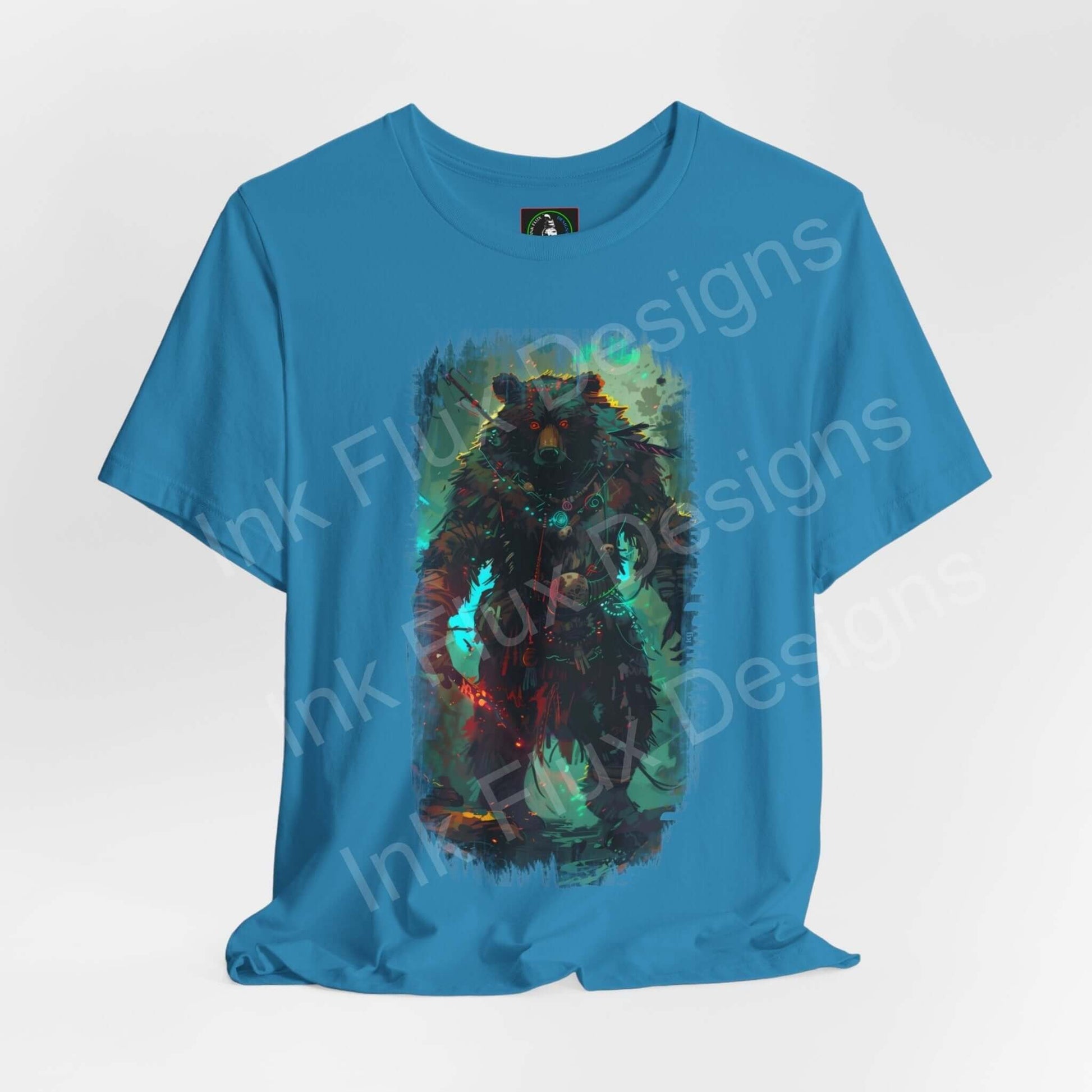 Spirit animal themed graphic tee featuring a mystical bear design on a blue unisex T-shirt from Bella+Canvas, highlighting sustainability and style.