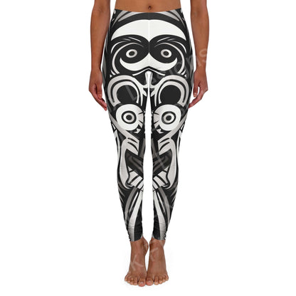 Woman standing wearing Trippy Leggings VIII with bold black and white abstract design, front view, highlighting a skinny fit and double layer waistband.