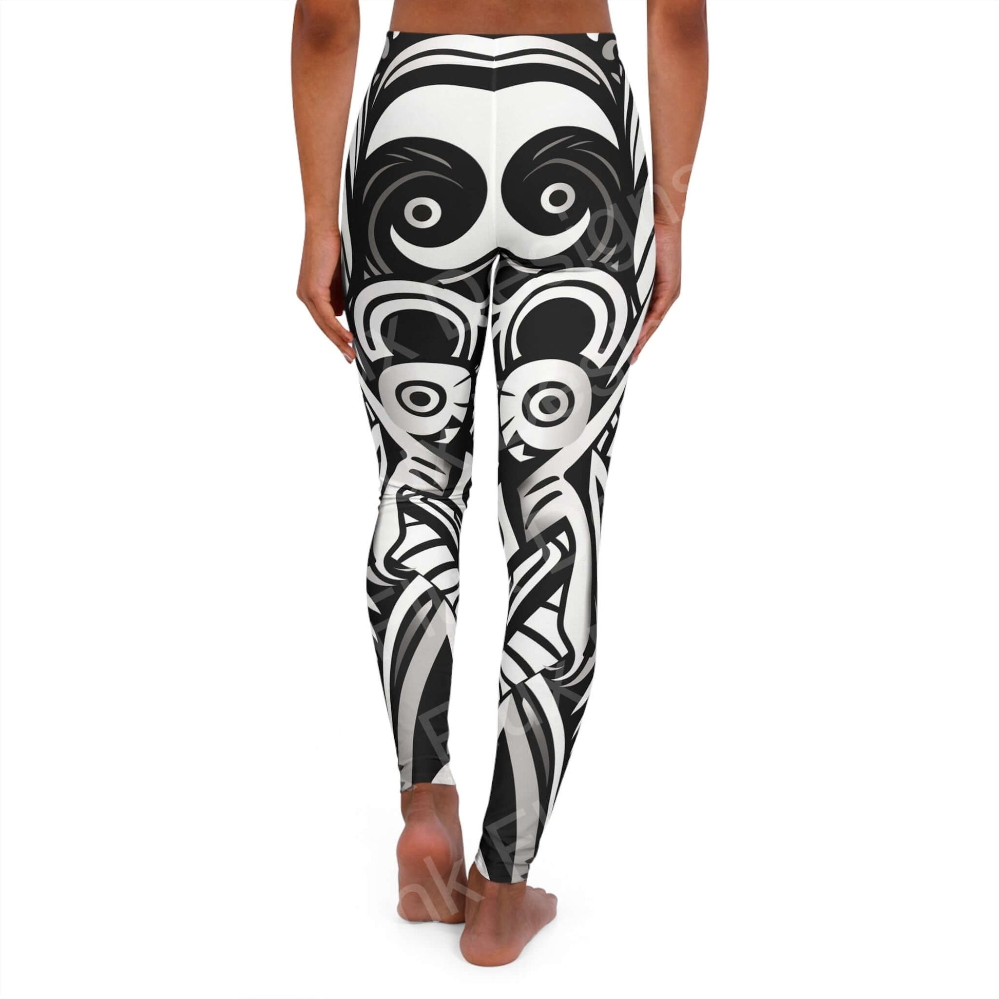Woman wearing Trippy Leggings VIII with bold black and white swirl designs, showcasing the stretchy fit and double-layer waistband.