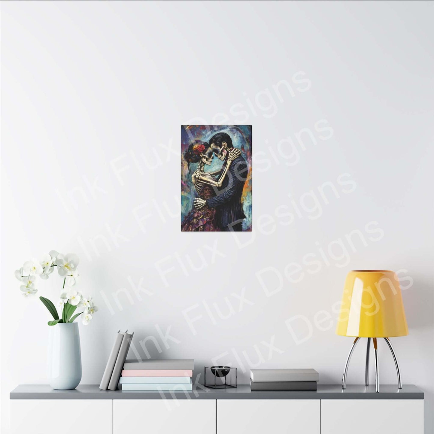 Day of the Dead couple portrait on matte canvas by Ink Flux Designs, showcased in a modern living room setting.