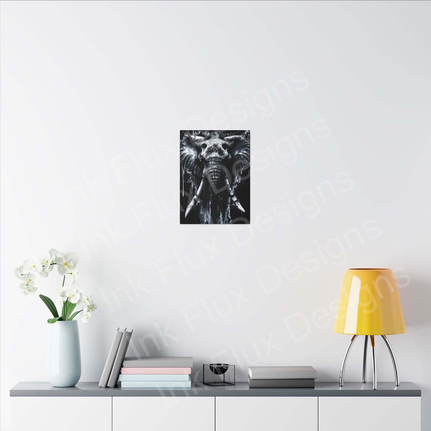 Elephant Spirit II Canvas by Ink Flux Designs displayed in a modern living space with yellow lamp and flowers.
