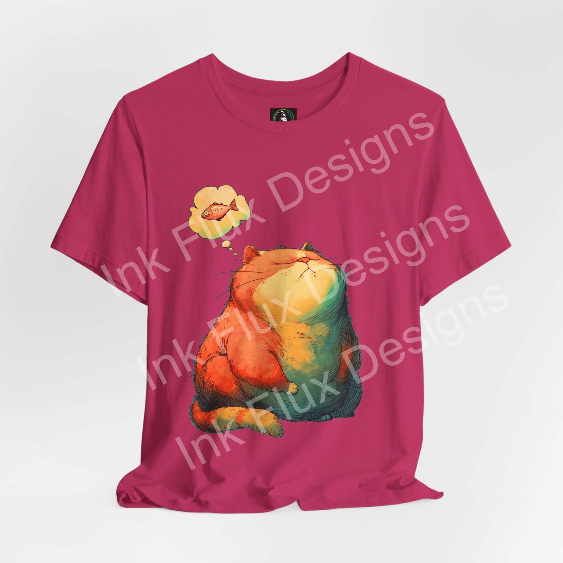 Funny Cat T-Shirt featuring chubby orange cat dreaming of fish on a vibrant pink background.