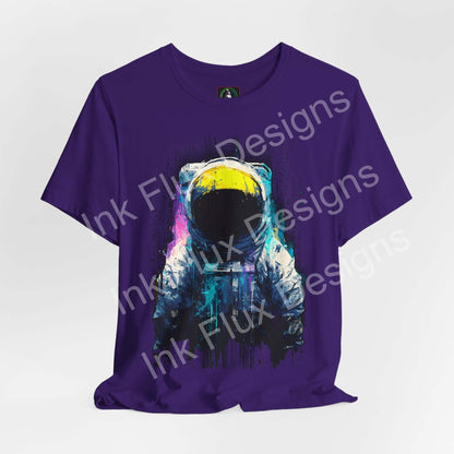 Graphic T-Shirt featuring a surreal astronaut design in vibrant colors on a purple background.