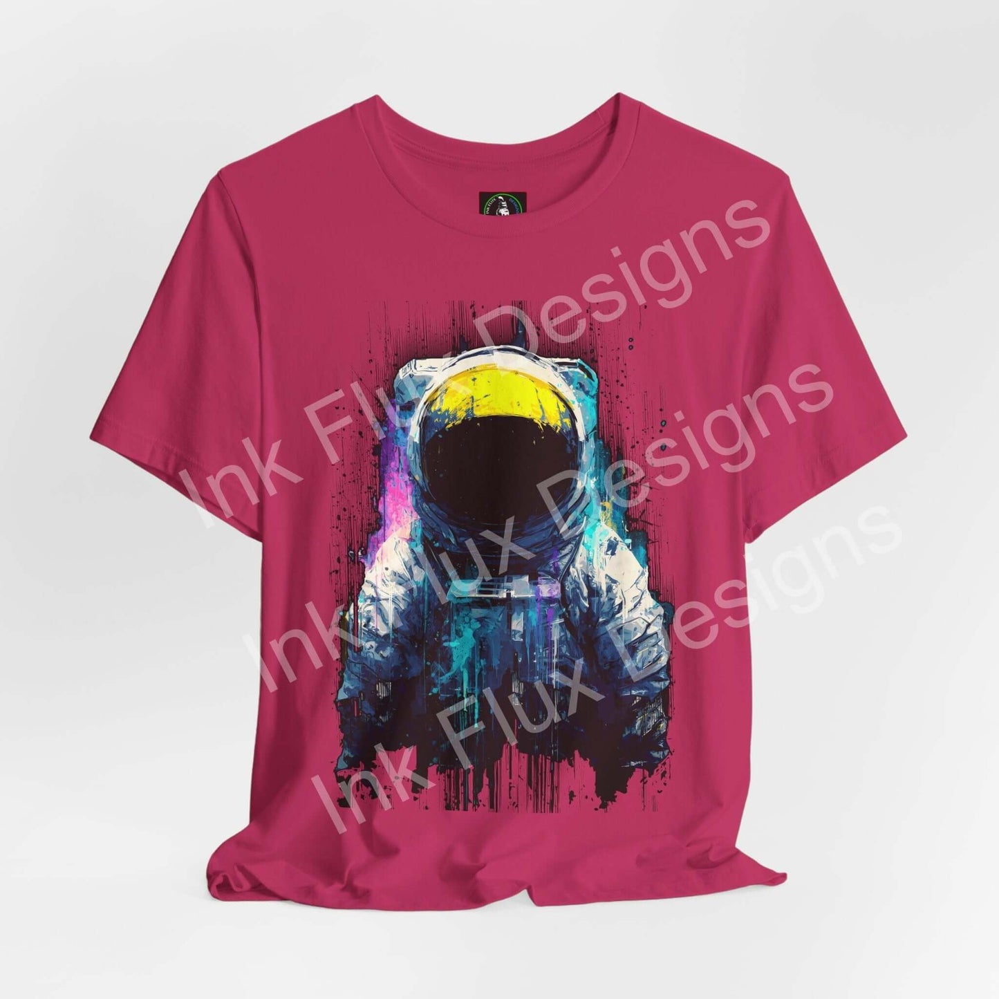 Graphic T-Shirt featuring a surreal astronaut design on a vibrant pink background, showcasing cosmic art.