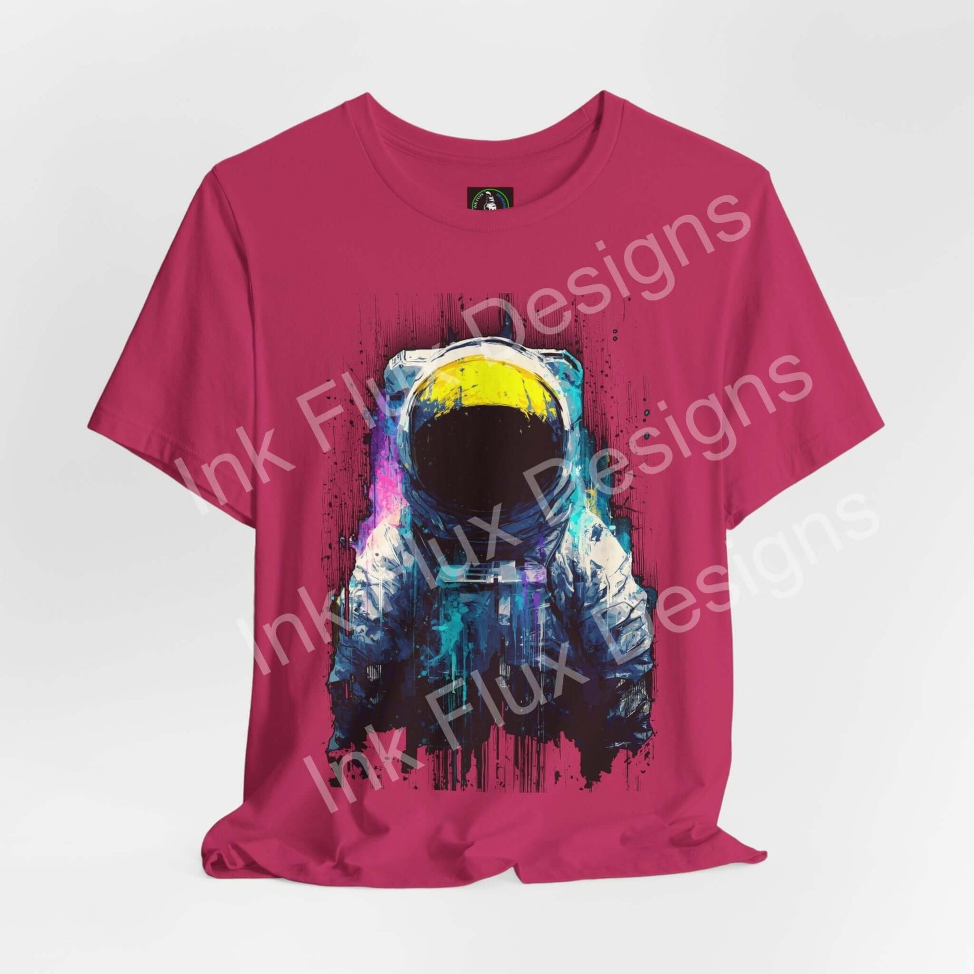Graphic T-Shirt featuring a surreal astronaut design on a vibrant pink background, showcasing cosmic art.