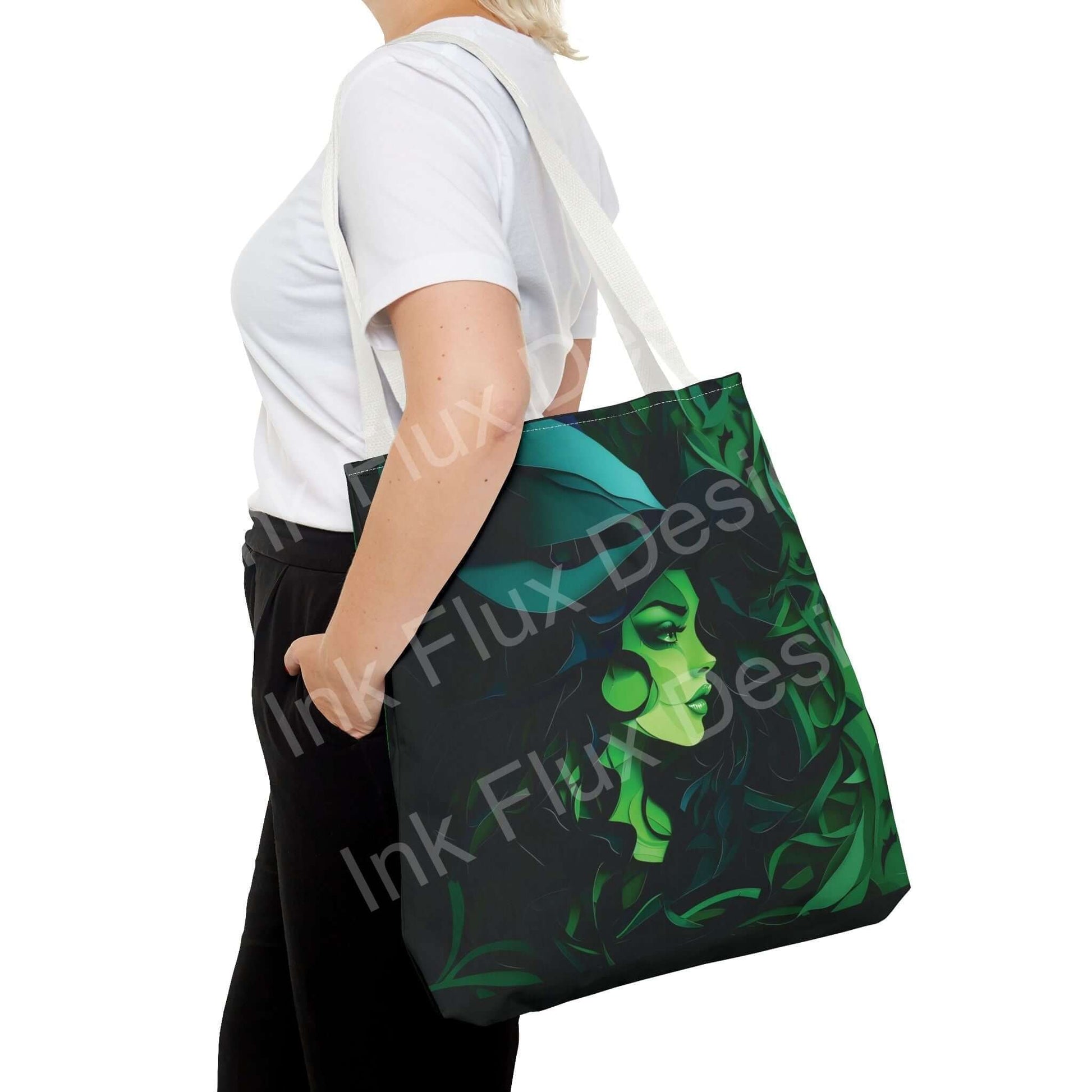 Person holding a Halloween Tote Bag featuring Green Witch design, perfect for festive Halloween celebrations.