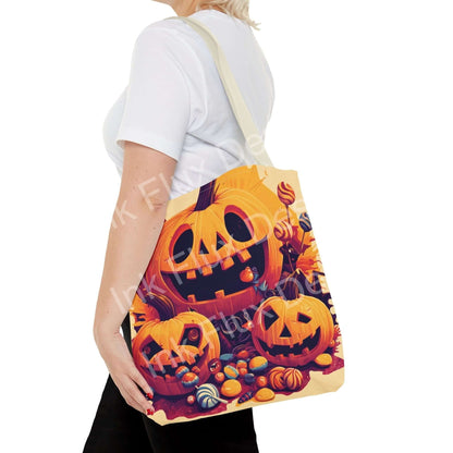 Halloween Tote Bag featuring classic Jack O Lantern pumpkin art design with vibrant colors and playful fall decorations.