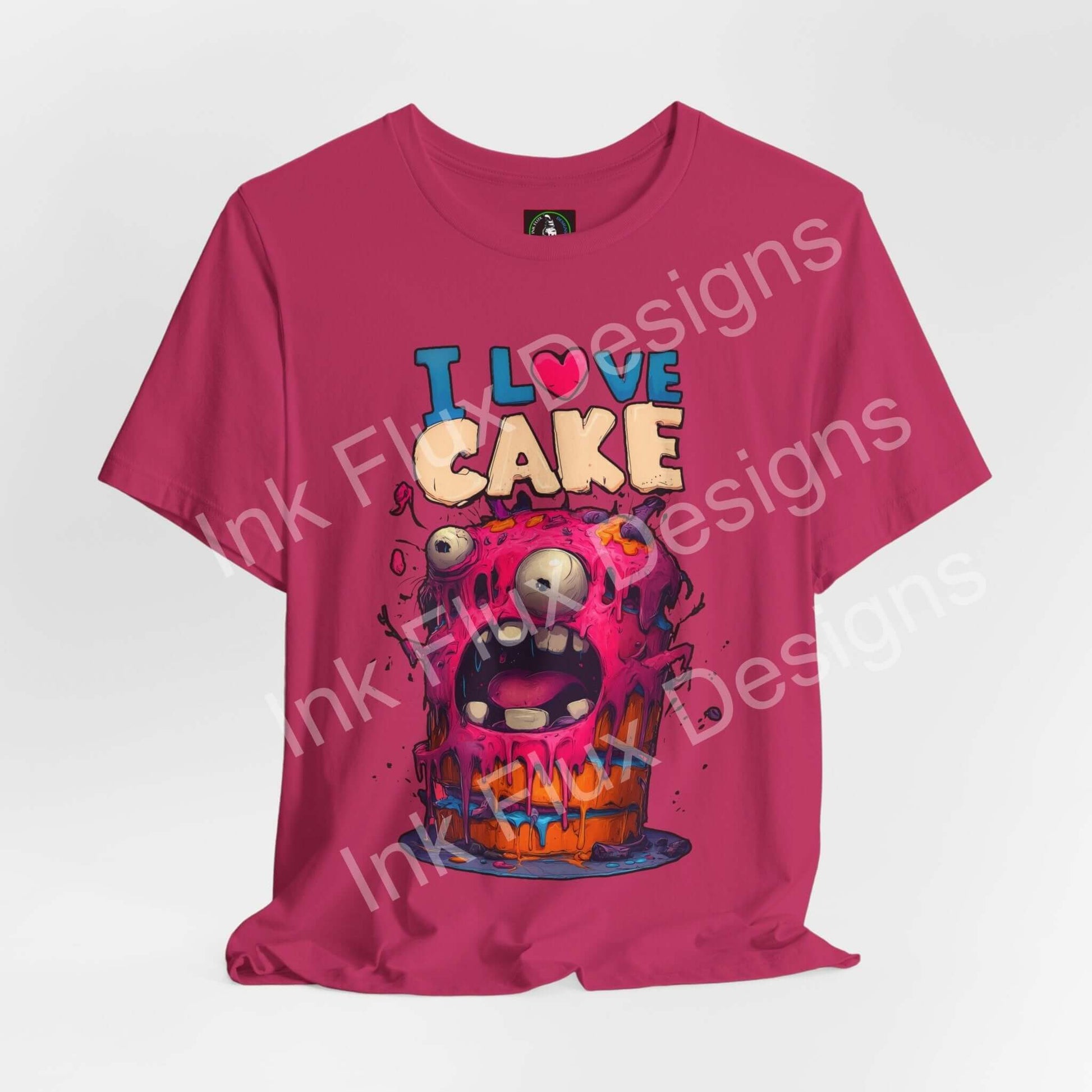I Love Cake Funny Graphic T-Shirt featuring a colorful monster cake design with oversized eyes and vibrant colors.