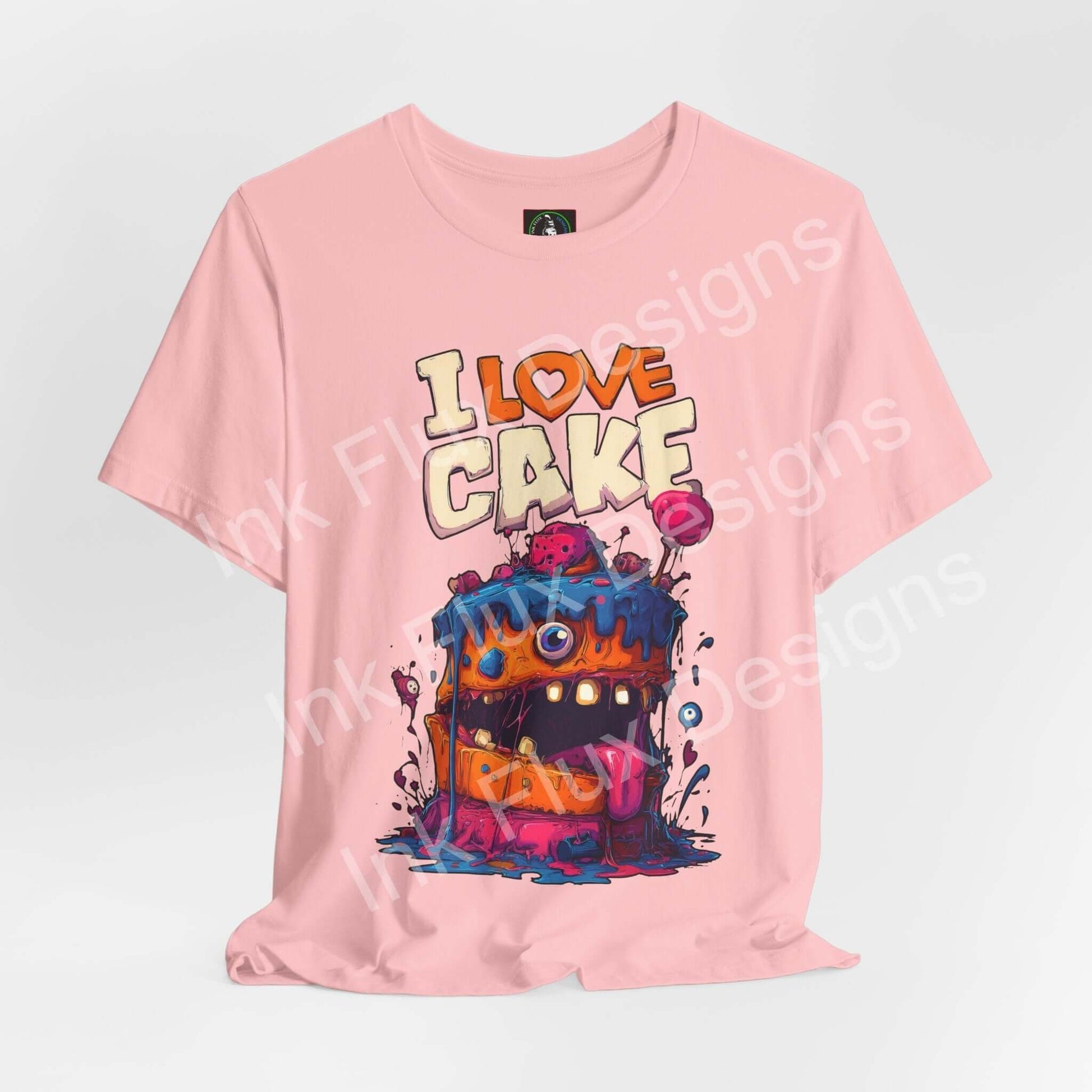 Funny Graphic T-Shirt featuring a cartoon monster cake with vibrant colors and playful design.