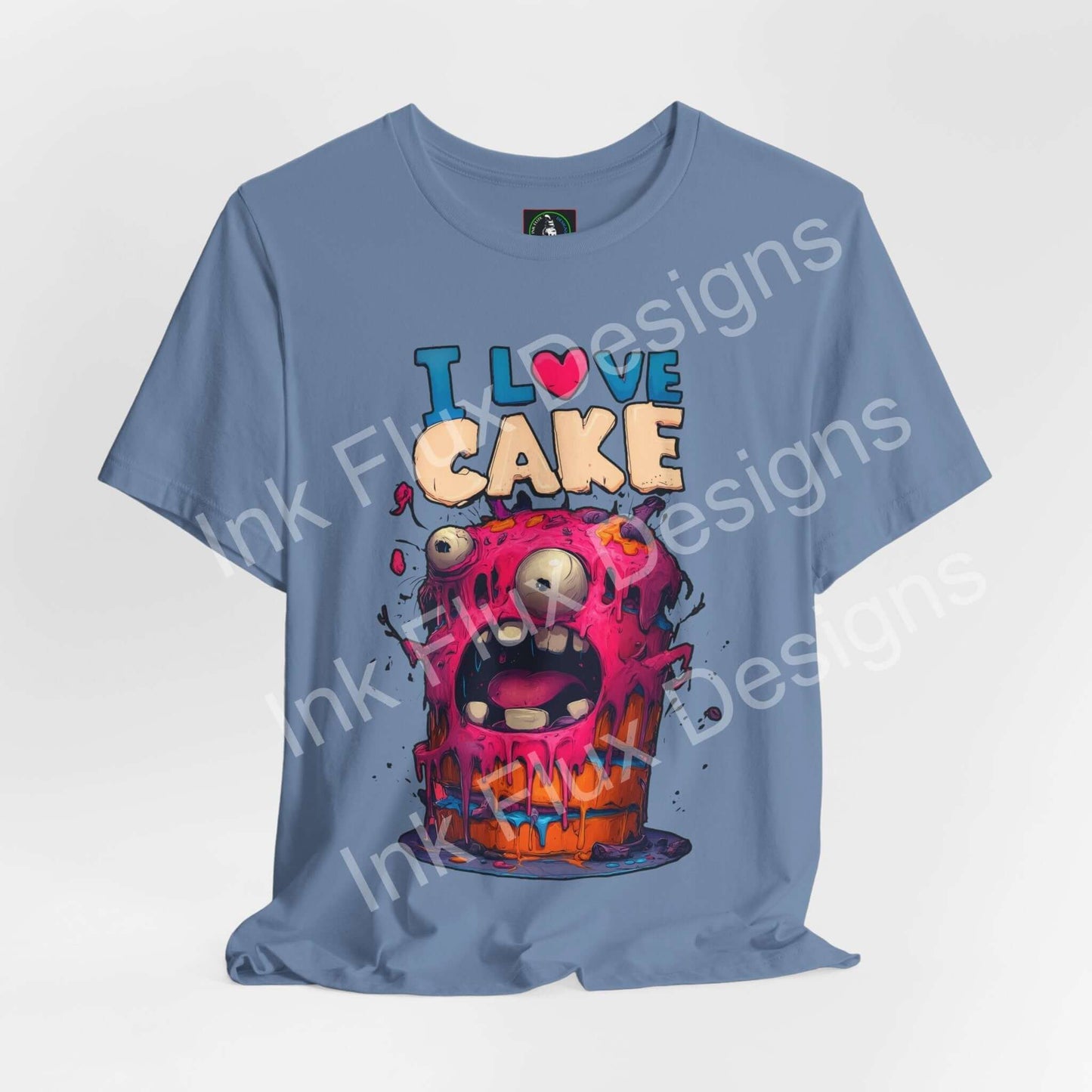 Funny Graphic T-Shirt featuring a monster cake design with colorful frosting and playful expression.
