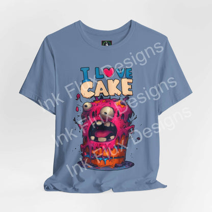 Funny Graphic T-Shirt featuring a monster cake design with colorful frosting and playful expression.