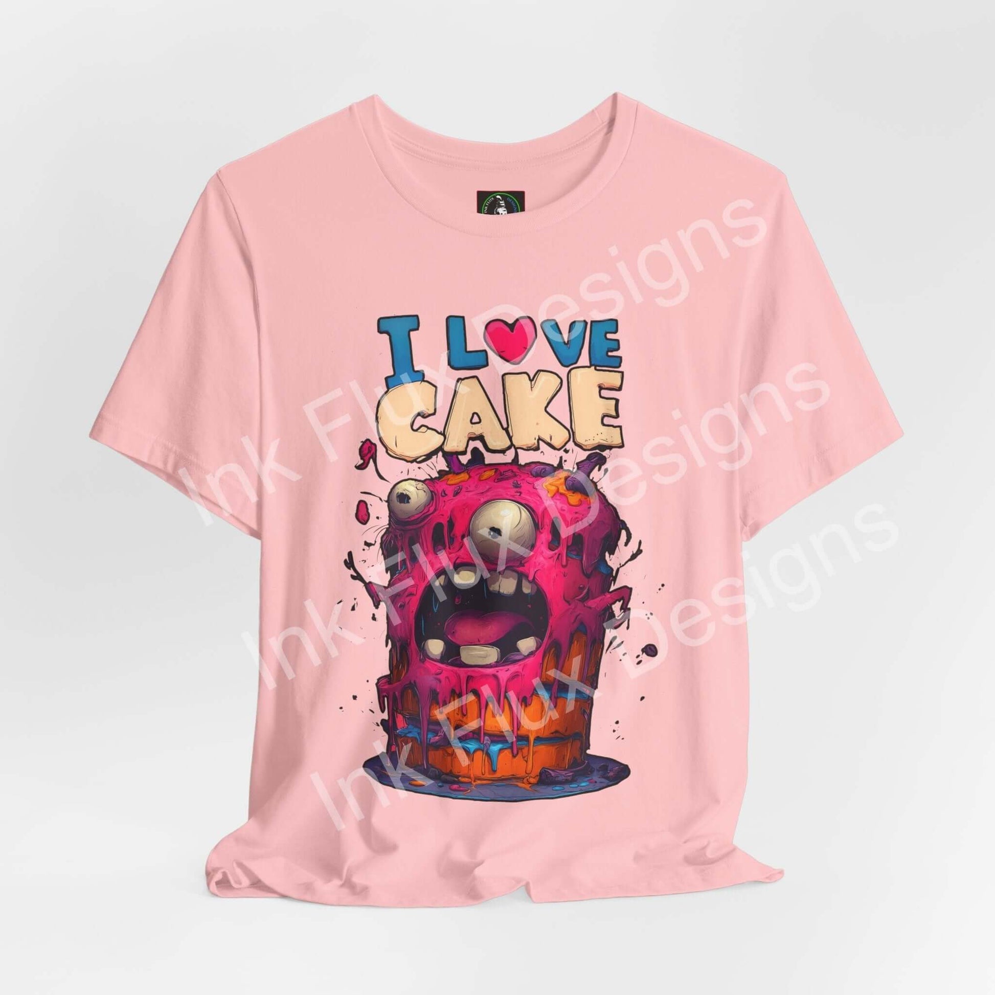 I Love Cake Funny Graphic T-Shirt featuring a monster cake cartoon design with vibrant colors and humorous expression.