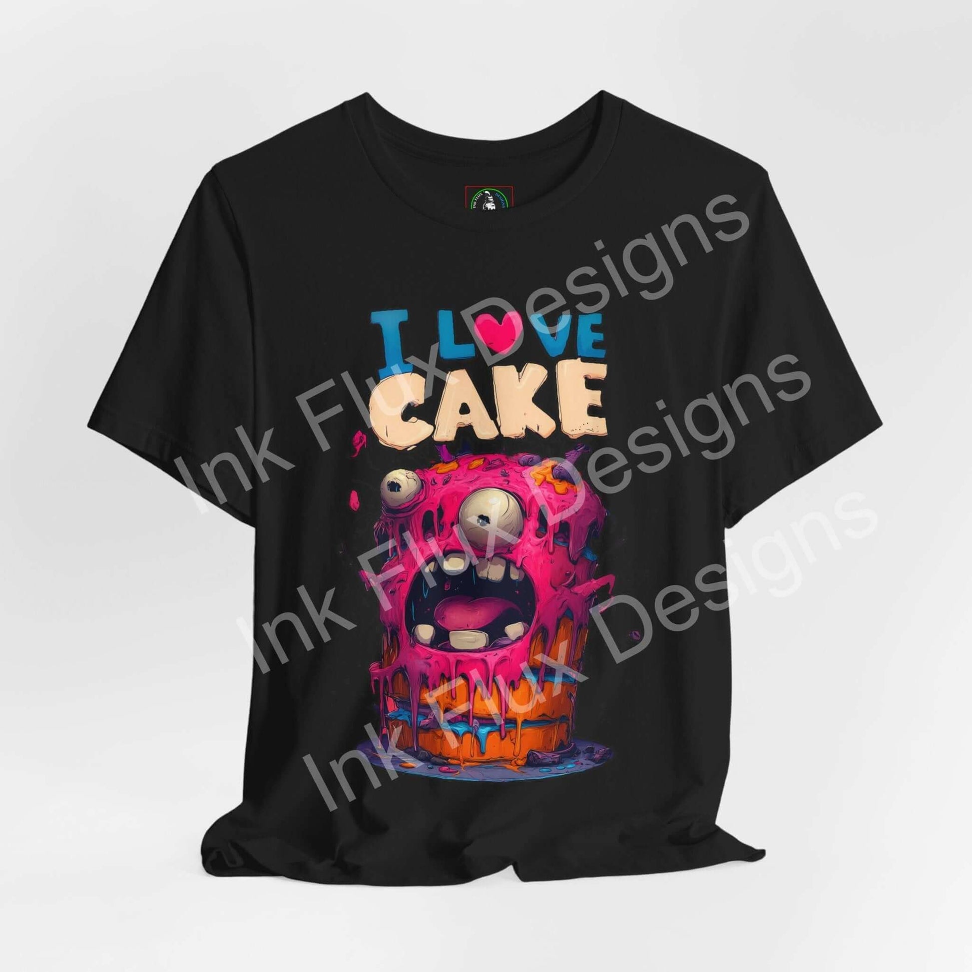 I Love Cake Funny Graphic T-Shirt featuring a colorful monster cake design with melting frosting and oversized eyes.
