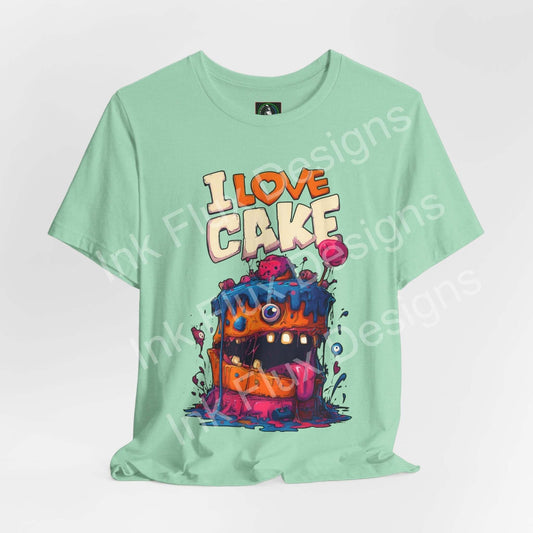 I Love Cake II Funny Graphic T-Shirt featuring a monster cake design with vibrant colors and cartoonish style.