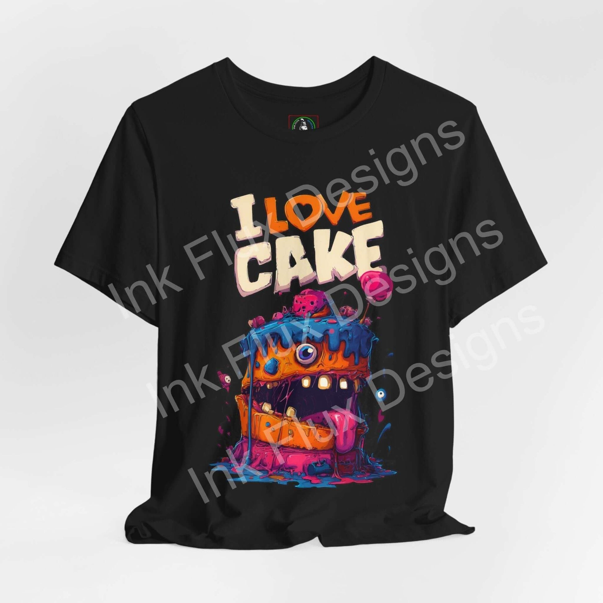 I Love Cake II Funny Graphic T-Shirt featuring a colorful monster cake design with bold cartoon art and exaggerated features.