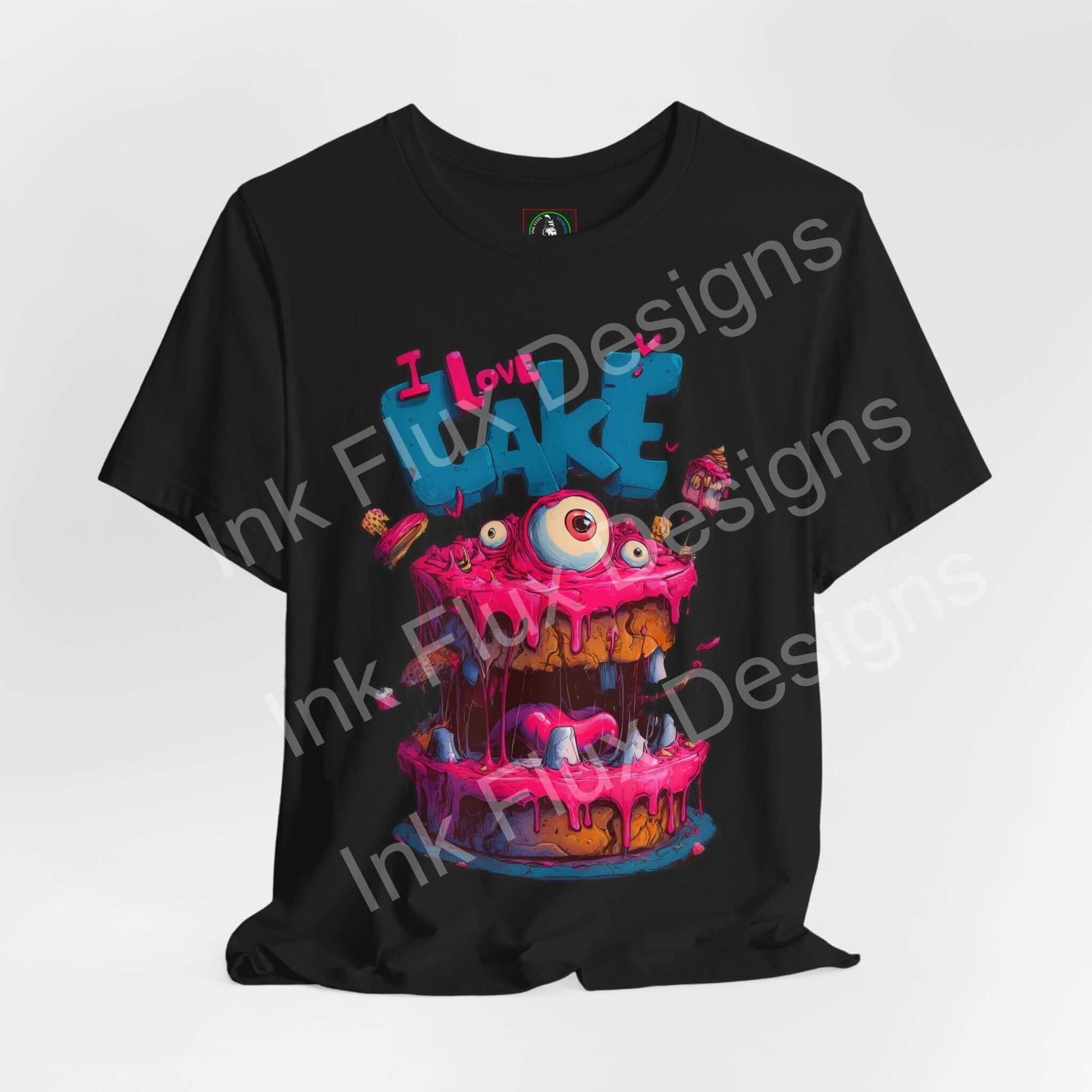 I Love Cake III Funny Graphic T-Shirt featuring a colorful monster cake with oversized eyes and frosting.