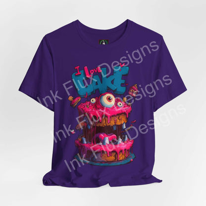 Funny Graphic T-Shirt featuring a colorful monster cake design with three eyes and pink icing.