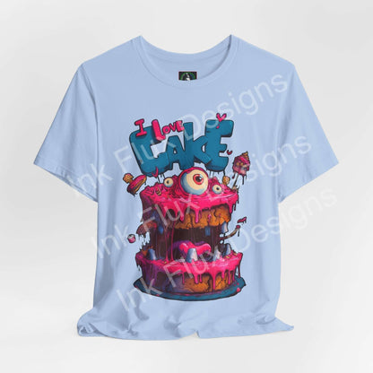 I Love Cake III Funny Graphic T-Shirt featuring a colorful monster cake design with oversized eyes and dripping icing.