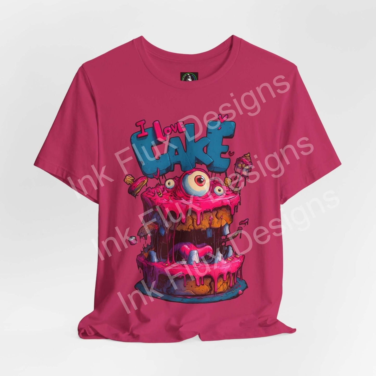 Funny Graphic T-Shirt featuring a colorful monster cake design with oversized eyes and dripping icing.