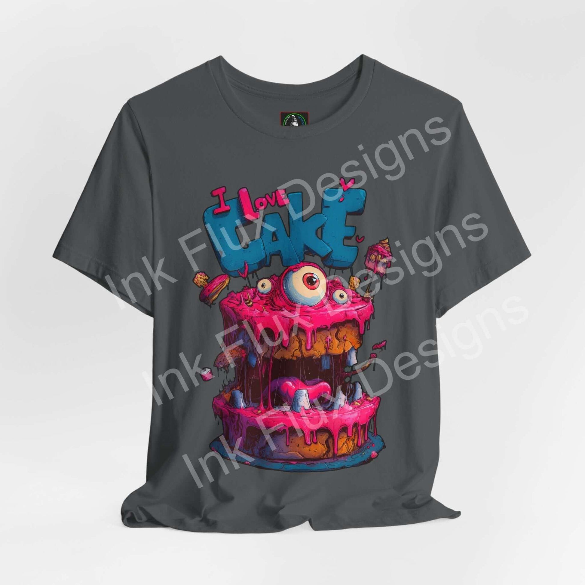 I Love Cake III Funny Graphic T-Shirt featuring a cartoon monster cake with bright pink icing and playful design.