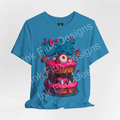 Funny Graphic T-Shirt featuring a colorful Monster Cake with oversized eyes and dripping pink icing.