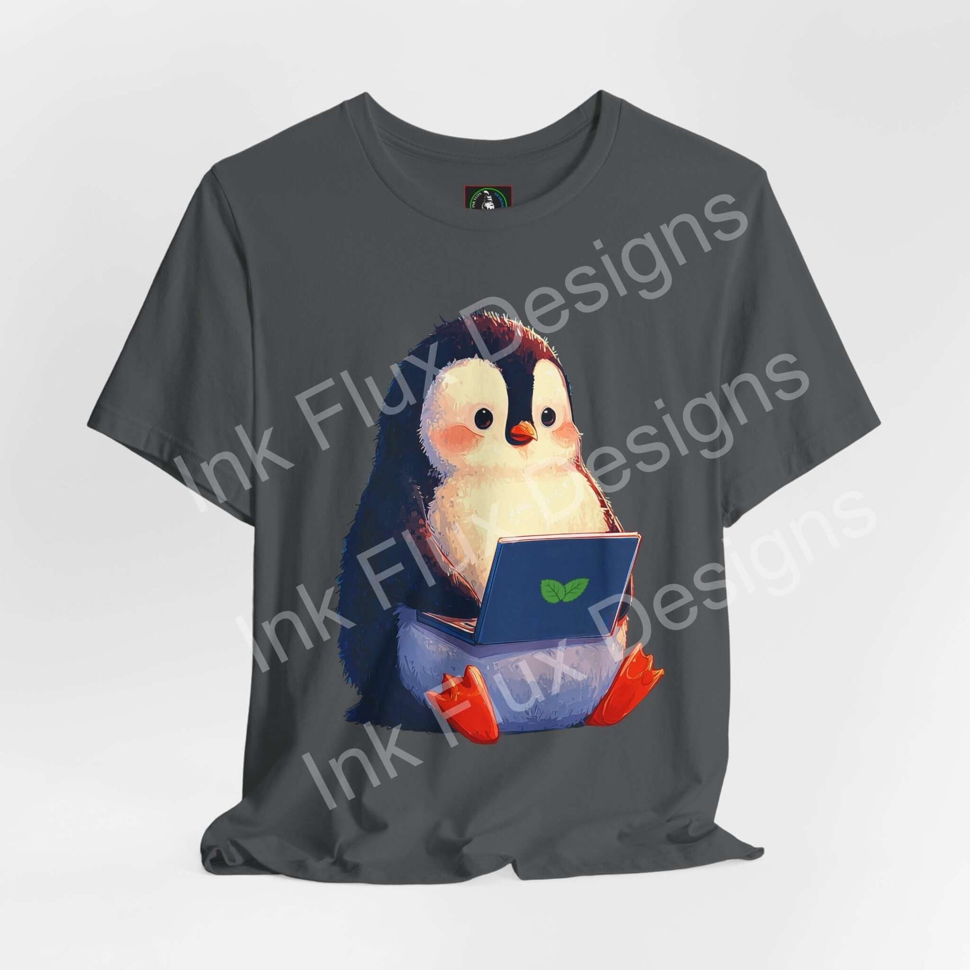 Minty Penguin Fun Graphic T-Shirt featuring a cute penguin with a laptop, perfect for creative and tech enthusiasts.