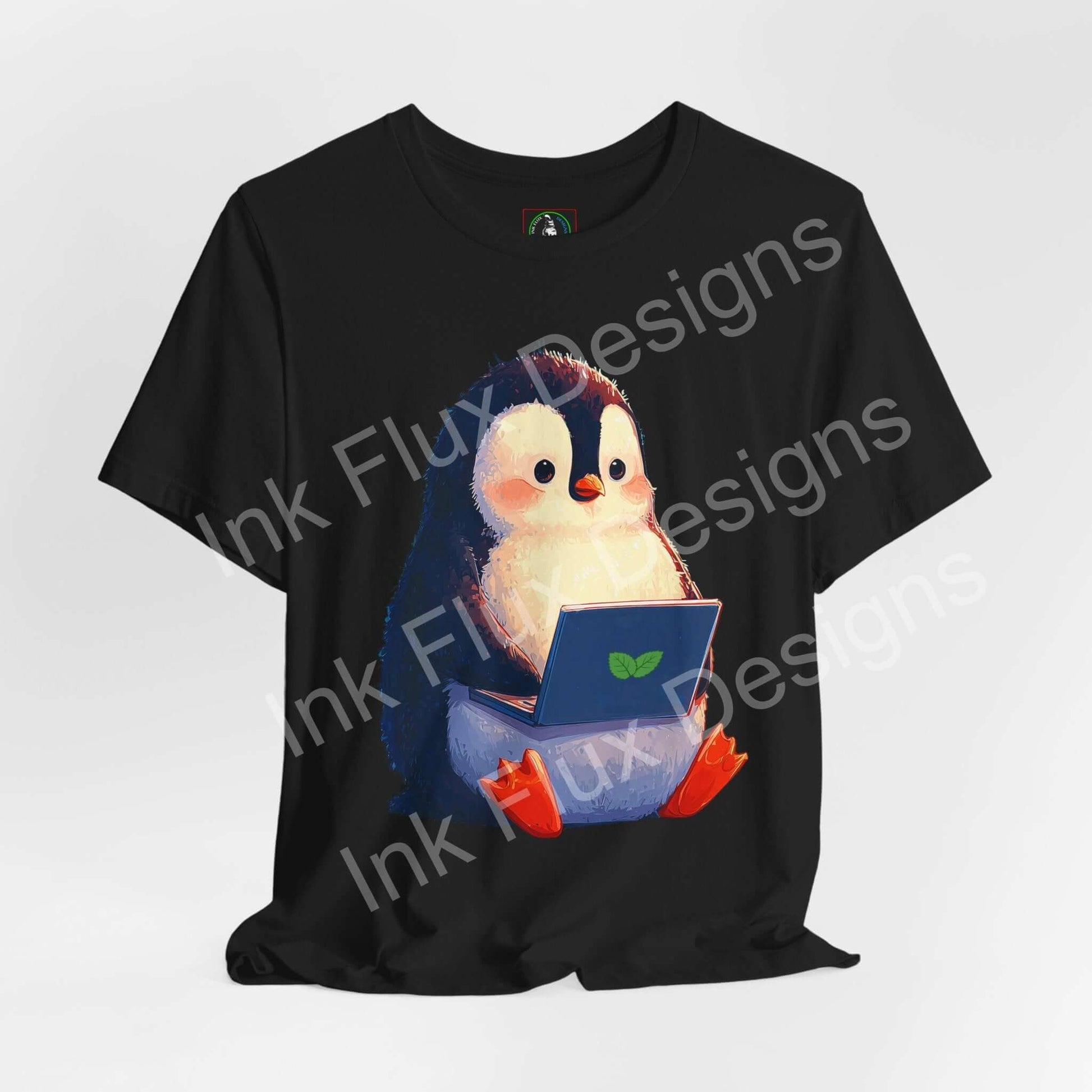 Minty Penguin Fun Graphic T-Shirt featuring an adorable penguin with a laptop design on a black tee.