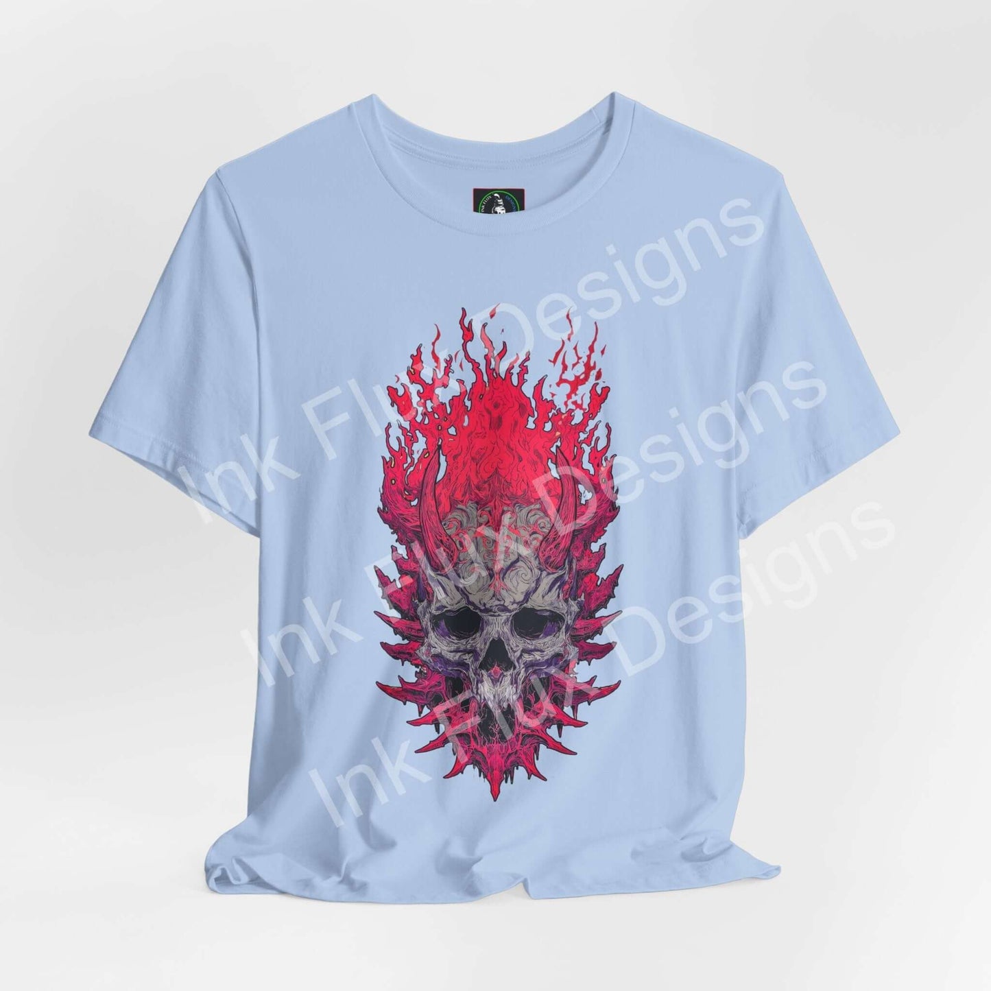 Skull Graphic T-Shirt featuring a flaming skull design with aggressive textures on a light blue background.