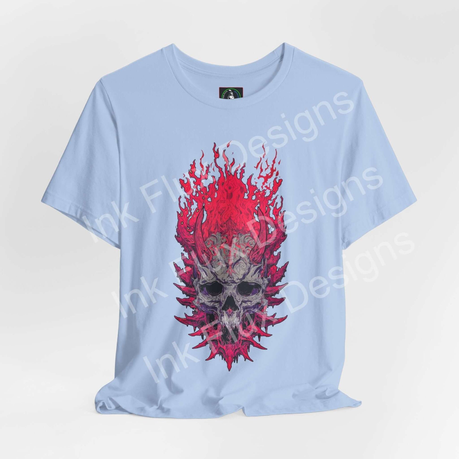 Skull Graphic T-Shirt featuring a flaming skull design with aggressive textures on a light blue background.