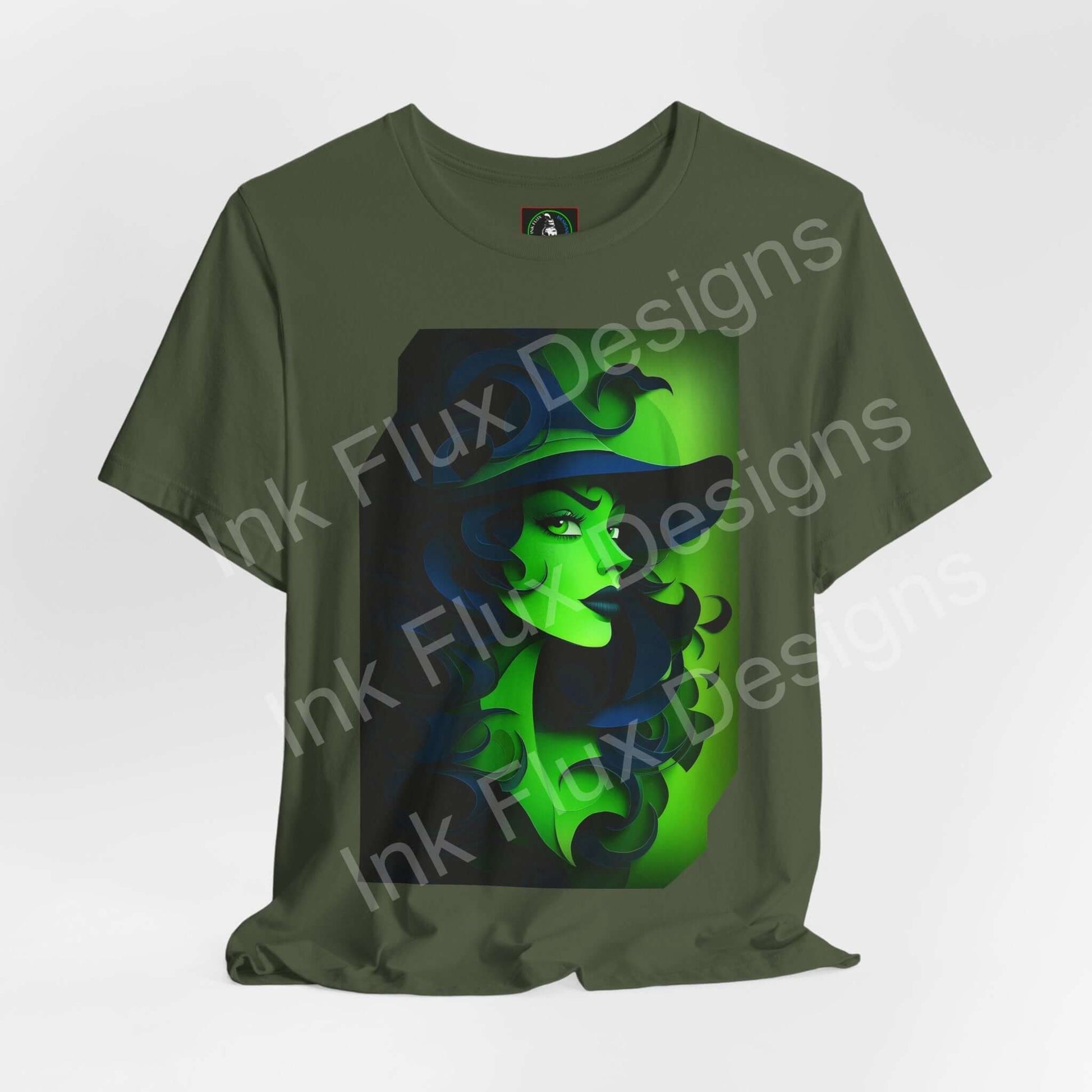 green witch t-shirt featuring a graphic design of a mystical witch in green hues on a soft olive tee.