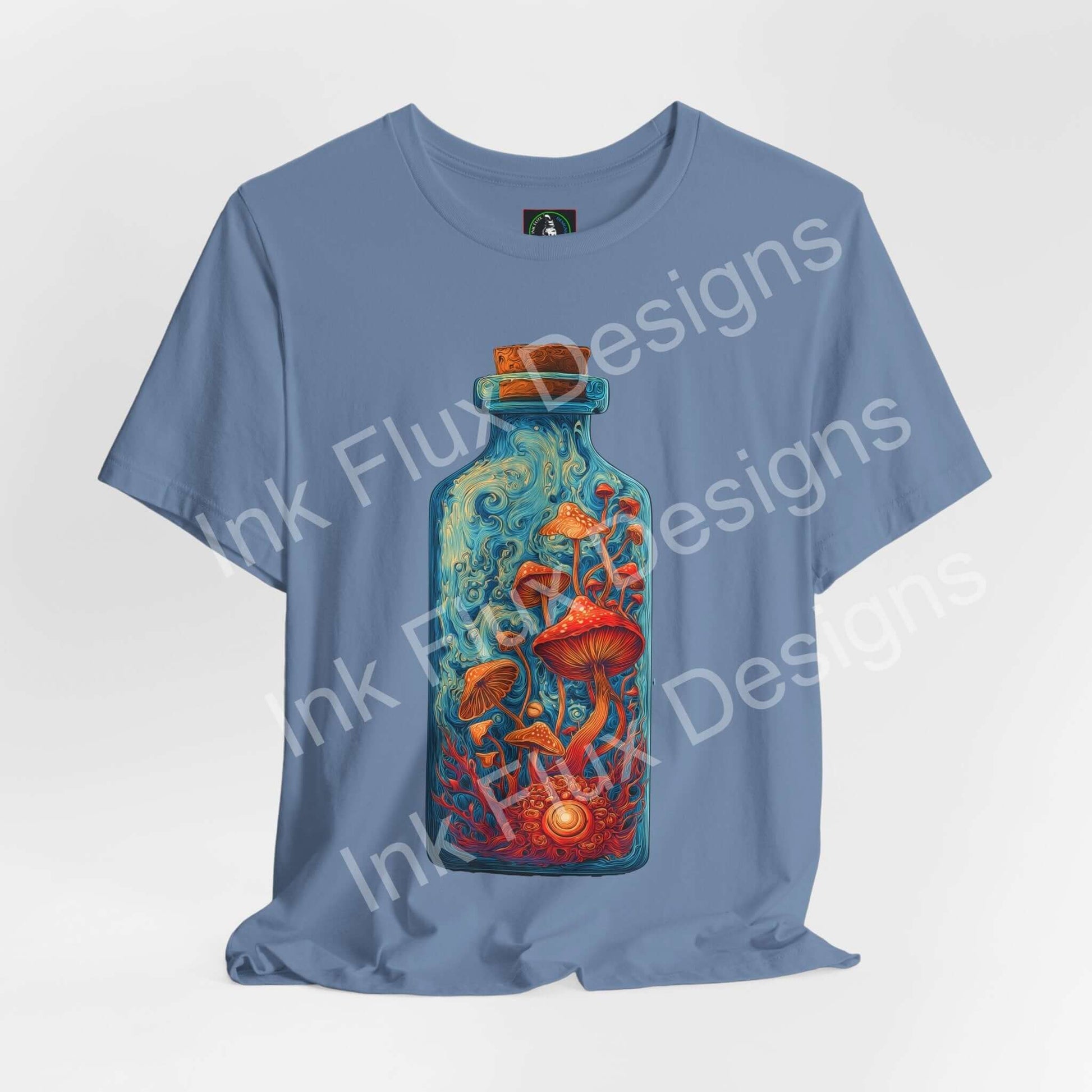 Psychedelic T-Shirt featuring vibrant mushroom bottle graphic on blue fabric, showcasing surreal fungi art.