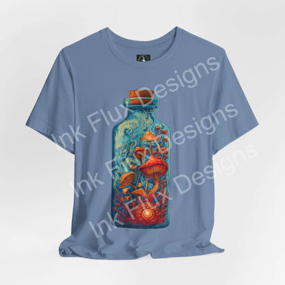 Psychedelic T-Shirt featuring vibrant mushroom bottle graphic on blue fabric, showcasing surreal fungi art.
