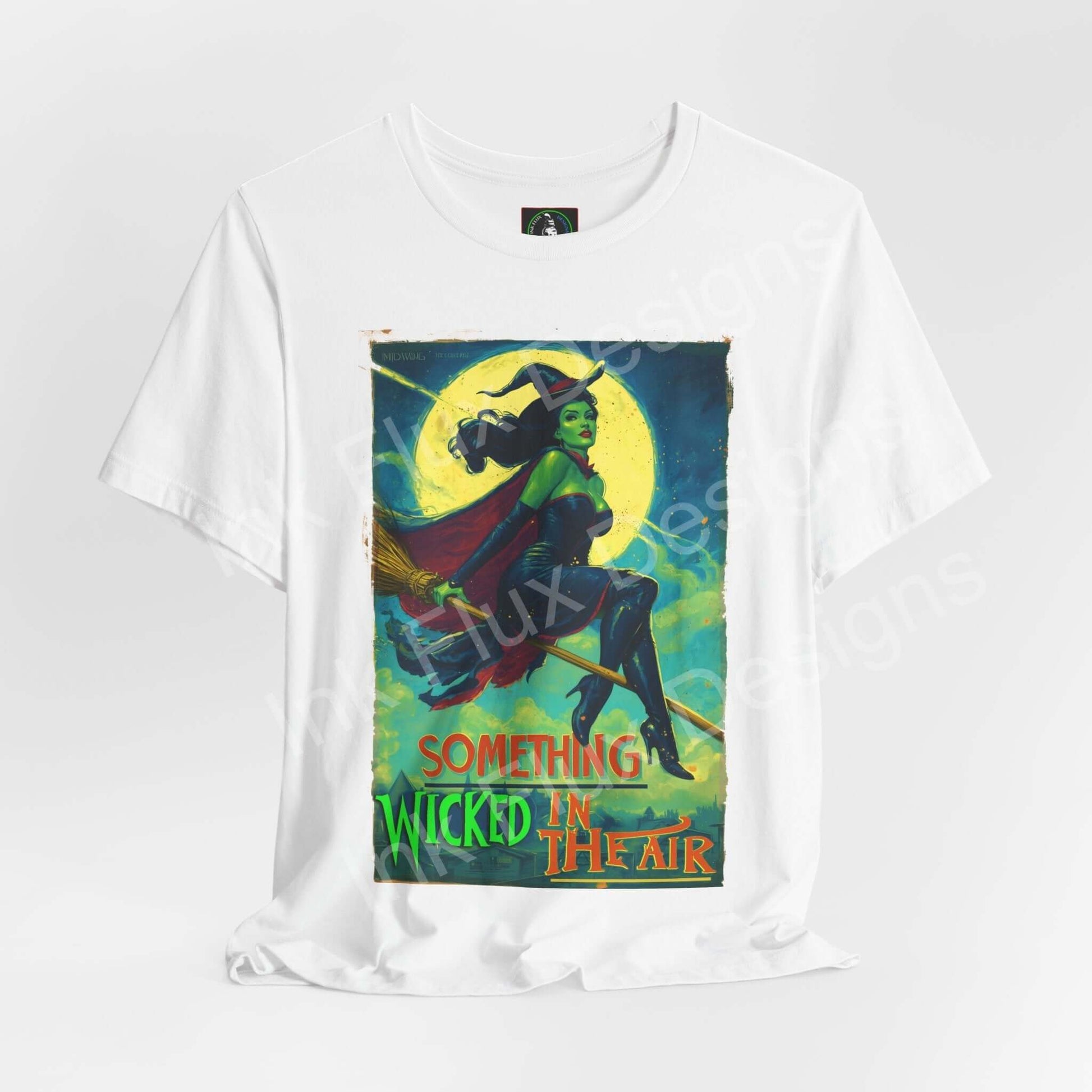 Halloween witch t-shirt featuring a graphic of a witch flying on a broom with the text 'Something Wicked in the Air'.