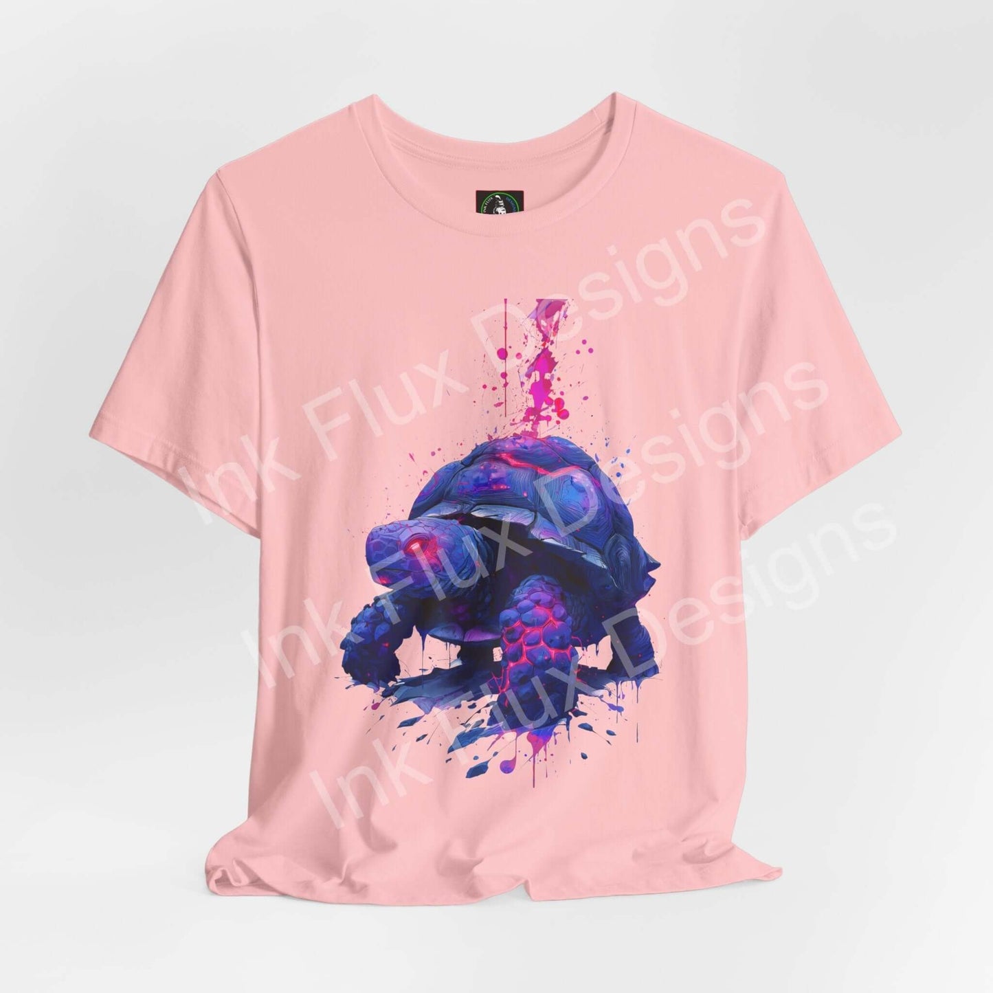 Spirit Animal T-Shirt with vibrant turtle graphic on pink background, symbolizing wisdom and endurance.