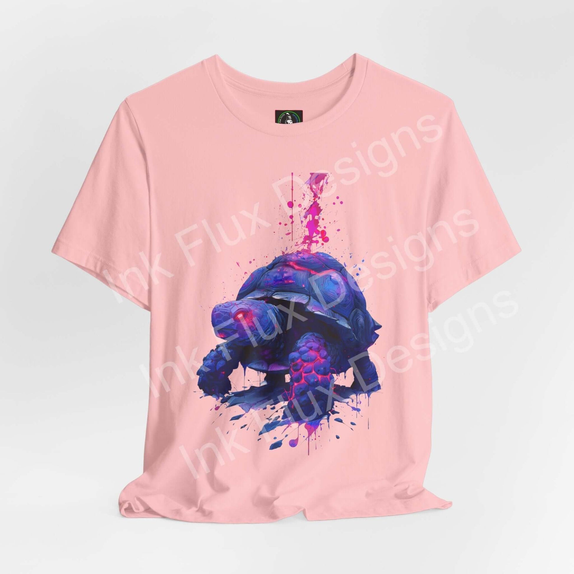 Spirit Animal T-Shirt with vibrant turtle graphic on pink background, symbolizing wisdom and endurance.